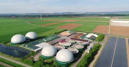 depositphotos-200156308-stock-video-wind-turbine-and-biogas-plant